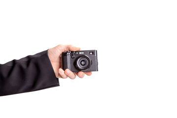 Aufkleber - male hand holding a camera isolated on white