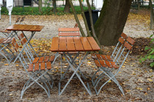 Benches And Chairs At Tables Invite You To Relax And Unwind