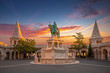 Budapest, Hungary - Amazing golden sunrise over Fisherman's Bastion at autumn with statue of king St.Stephen, the first king of Hungary