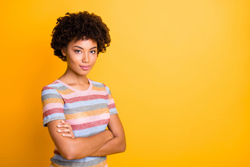 Sticker - Photo of amazing dark skin business lady holding arms crossed reliable person wear casual striped t-shirt and trousers isolated on yellow background