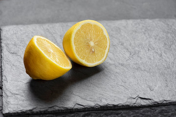 Sticker - Fresh lemon on a grey stone board