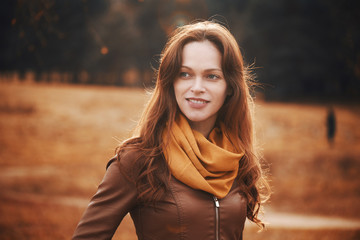 Wall Mural - Happy pretty girl in the autumn park