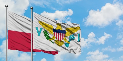 Poland and United States Virgin Islands flag waving in the wind against white cloudy blue sky together. Diplomacy concept, international relations.