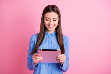Wall Mural - photo of cheerful cute nice charming girlfriend holding electronic tablet with her hands browsing th