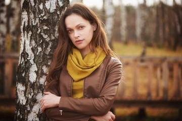 Poster - Outdoors portrait of a pretty woman in the autumn park