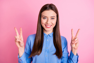 Poster - Photo of amazing lady showing v-sign symbols saying hello to friends wear blue dotted shirt with collar isolated pink color background