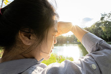 Asian Woman Have Conjunctivitis,cataract,young Female Covering Face By Hand Of Bright Sun In Outdoor On Sunny Day,feel Dizzy,risk Of Eye Damage From Ultraviole(UV Rays),photophobia,eye Health Concept
