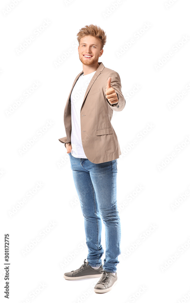Portrait of happy man showing thumb-up gesture on white background