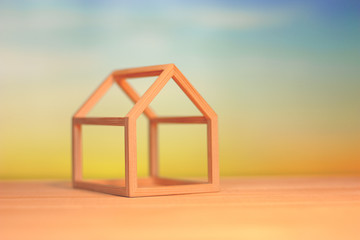 mall model house on wood table with nature background.