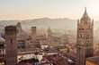 Bologna, cityscape and buildings at sunset, San Pietro Cathedral Bell Tower and San Luca hill. Emilia Romagna, Italy