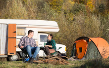 Happy Couple In Autumn Relaxing Tegether In A Campsite
