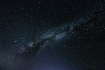 Fototapete - Milky way galaxy with stars and space in the universe background at thailand