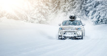 CORTINA D'AMPEZZO, ITALY - JANUARY 31, 2019: Winter Roads In Beatiful Snowy Forest. Snow Calamity Or Blizzard On Street. Fast Modern Suzuki Vitara Car On Snow Road In Storm.