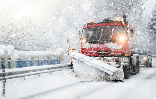 Winter highway maintenance, Snow plow vehicle or truck cleaning snow from road.