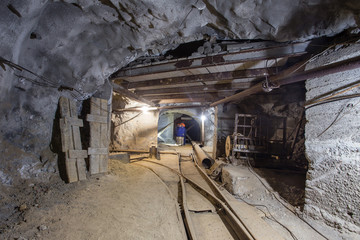 Wall Mural - Gold iron mine ore shaft tunnel two ways rails