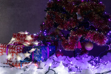 Christmas gifts and lights as holiday background