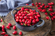 Rose hips in a pot on a table
