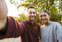 Photo Of Caucasian Happy Couple Taking Selfie Photo And Smiling