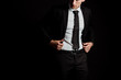 © LIGHTFIELD STUDIOS - cropped view of man touching suit isolated on black