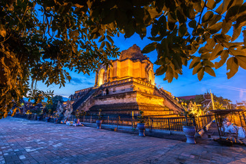 Wat Chedi Luang is a Buddhist temple in the historic centre and is a Buddhist temple is a major tourist attraction in Chiang Mai,Thailand.at twilight time blue sky clouds sunset background.