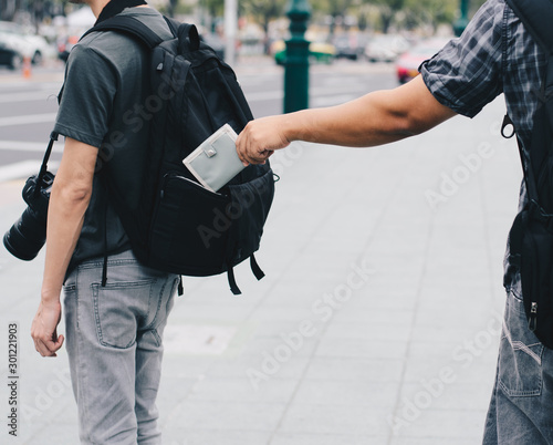 Fotomural Theft of a purse from a pocket behind