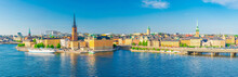Aerial Scenic Panoramic View Of Stockholm Skyline With Old Town Gamla Stan, Typical Sweden Houses, Riddarholmen Island With Gothic Church Building, Lake Malaren, Clear Blue Sky Background, Sweden