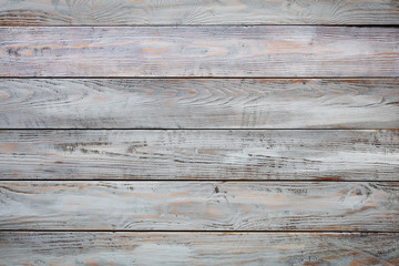 Gray wooden background with old painted boards