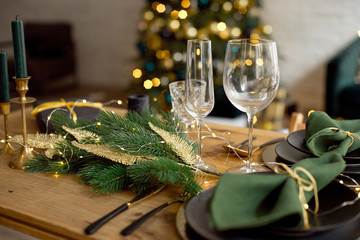 Wall Mural - Table served for Christmas dinner in living room, close-up view, table setting, Christmas decoration.