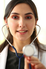 Portrait beautiful smiling female doctor hold