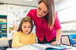 © Louis-Paul Photo - education and school concept little student girl studying at school