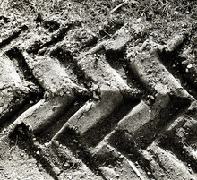 Beautiful Tractor Sand Tracks Sepia Effect Closeup Texture, Background. Agricultural Natural Ground Mark Backdrop.