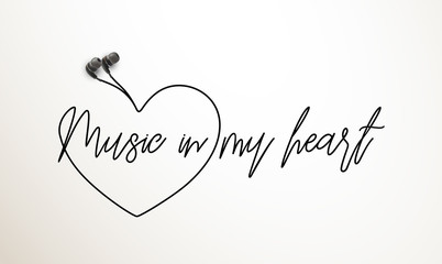 Wall Mural - Innovative music quotation template in headphones quotes isolated on backdrop. Creative banner illustration with quote in a frame wire with Black quotes. speech bubble inscription: Music in my heart