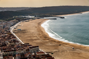 Wall Mural - Evening time by Atlantic ocean in Nazare, Portugal.