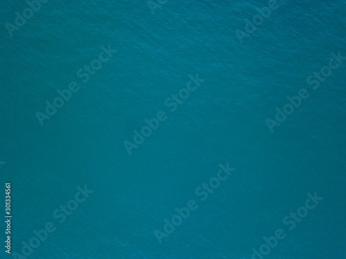 Cuadros en Lienzo Aerial view of tranquil sea surface with stones and rocks in water