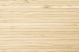 Fototapeta Fototapety do sypialni na Twoją ścianę - Bamboo wood texture background in natural light yellow brown color .
