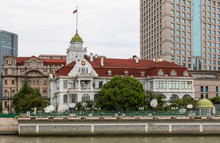 Consulate General Of The Russian Federation In Shanghai, At Riverside Of Suzhou Creek And Huangpu River, Hongkou, Shanghai, With Russian Flag Flying On Flagpole.