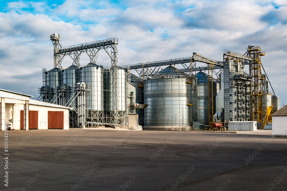 agro-processing and manufacturing plant for processing and silver silos for drying cleaning and storage of agricultural products, flour, cereals and grain. Granary elevator - obrazy, fototapety, plakaty 