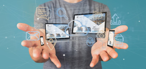 Poster - Businessman holding a Devices connected to a cloud multimedia network 3d rendering