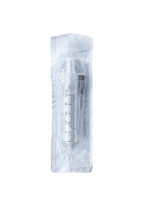 Disposable Plastic Syringe With Needle In The Package On A White Background