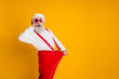 © deagreez - Profile side photo of crazy funky white beard hair santa claus in hat hold big size pants lose weight x-mas celebrate noel diet effect scream isolated yellow color background