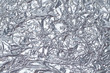 © SERGIYVOLODYMYROVYCH - Texture of crumpled silver foil