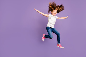 Canvas Print - Full body profile photo of funny small foxy lady jumping high rejoicing cheerful mood hairdo flying with warm wind wear casual white t-shirt jeans isolated purple background