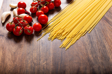 Wall Mural - Italian food ingredients for spaghetti with tomatoes sauce