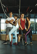 © master1305 - A group of muscular athletes doing workout at the gym. Gymnastics, training, fitness workout flexibility. Active and healthy lifestyle, youth, bodybuilding. Posing, looks confident and cool. Teamwork.