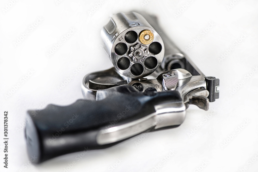 Smith & Wesson 357 magnum revolver with a single bullet. One shot one ...