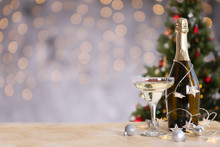 Beautiful Christmas Composition With Two Glasses Of Sparkling Wine, Decorations On Textured Table. New Year's Eve Tradition To Celebrate With Champagne. Close Up, Copy Space, Background.