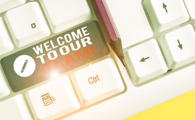 Conceptual hand writing showing Welcome To Our Team. Concept meaning introducing another demonstrating to your team mates White pc keyboard with note paper above the white background