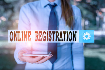 Leinwandbilder - Conceptual hand writing showing Online Registration. Concept meaning System for subscribing or registering via the Internet Business woman in shirt holding laptop and mobile phone