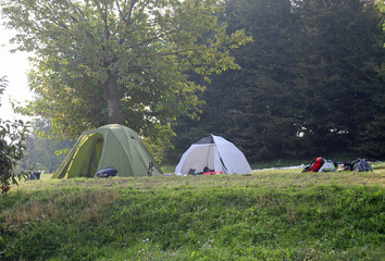 camp site with tents on summer