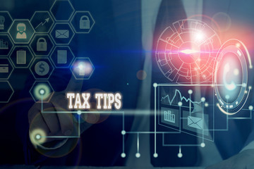  Conceptual hand writing showing Tax Tips. Concept meaning compulsory contribution to state revenue levied by government Picture photo network scheme with modern smart device